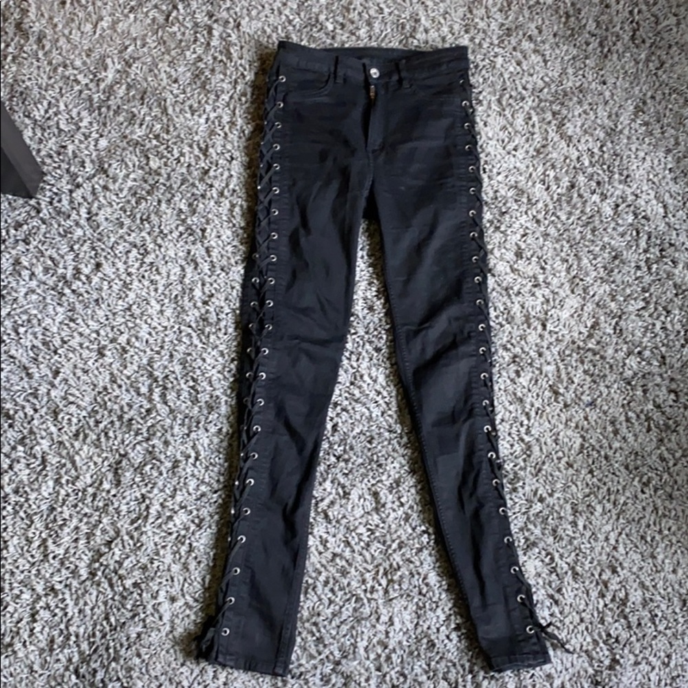 Black jeans with side tied details